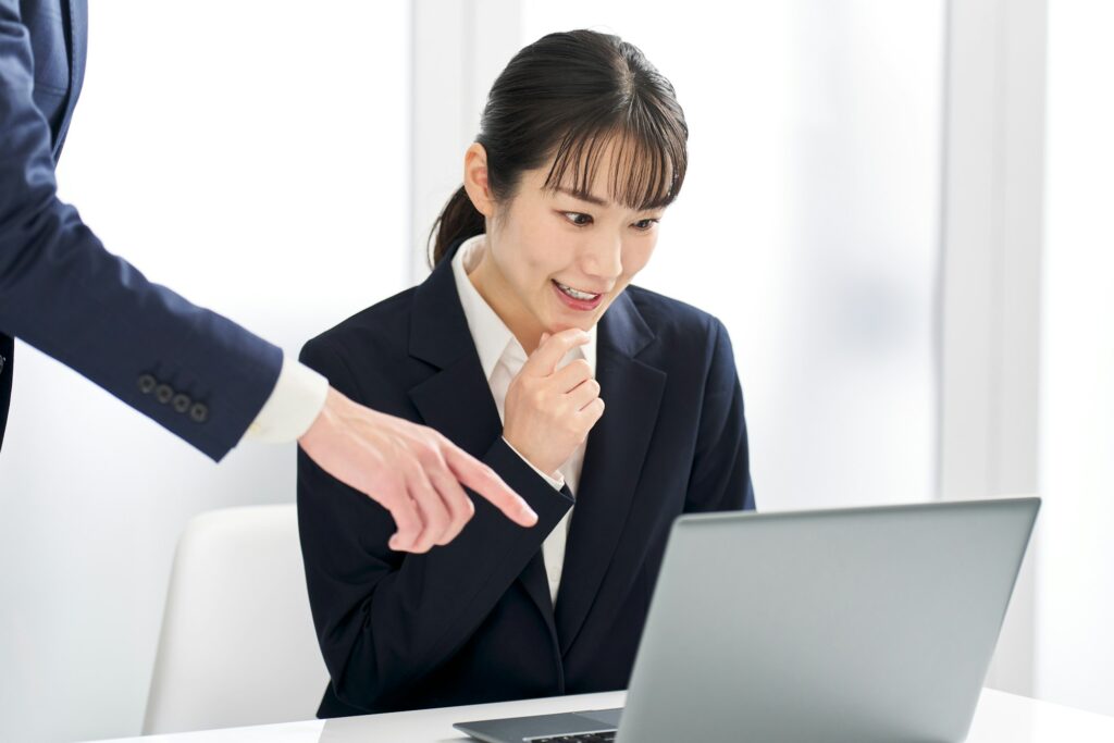 Business woman being pointed out for a mistake at work