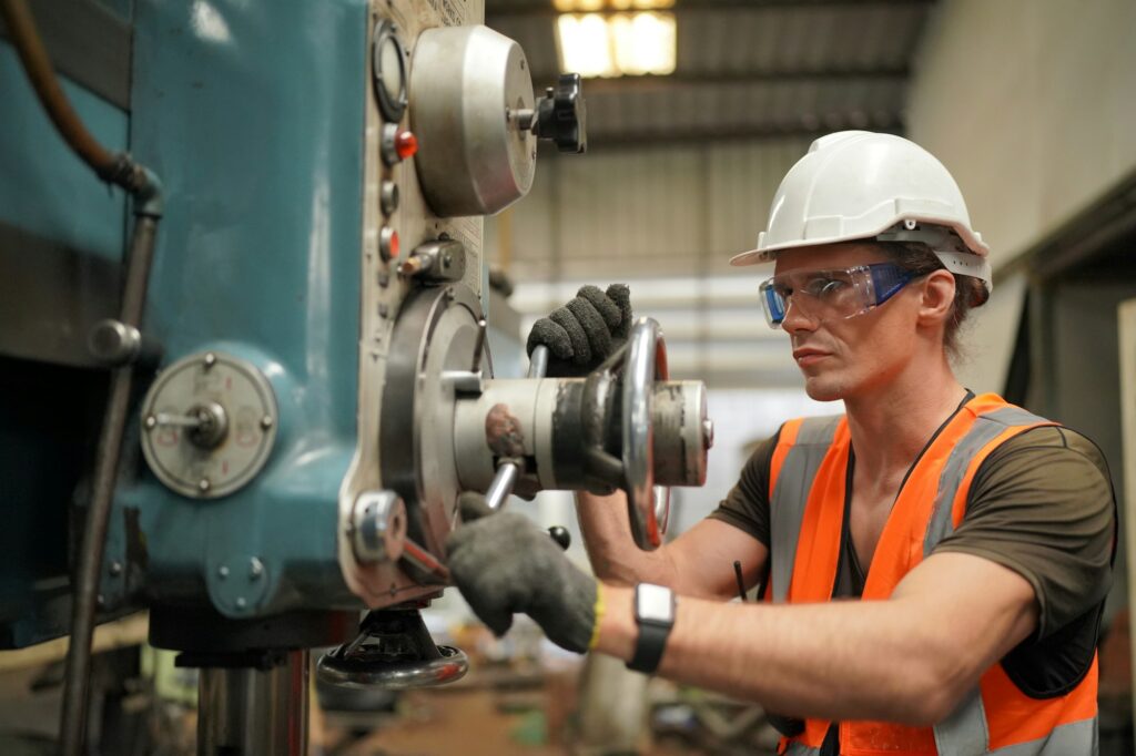 industrial factory employee working in metal manufacturing industry